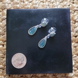 Blue and milky green dangle earrings in a silver toned setting